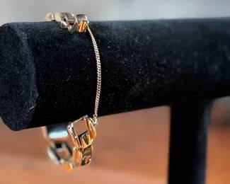 This lot features a 14k gold Leman watch with a total approx. weight of 28.5 grams. The watch is accompanied with an appraisal, is a manual wind with a 17-jewel Pathe Watch Co. movement, and runs/sets fine with safety clasp. The watch is 6.5” in length.

