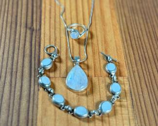 This lot features a beautiful set of jewelry set in sterling silver with what appears to be moonstones. The ring comes in a size 5.25, the bracelet measures, 7” and the necklace measures, 18”. Marked 925/Mexico and has a total approx. weight of 36.55 grams.

