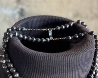 This lot features a vintage sterling silver beaded necklace with a total approx. weight of 23.81 grams. The "inner" necklace/choker measures, 14”.


