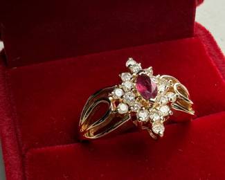 This lot features a 14k yellow gold ring with sixteen (16) round single cut genuine diamonds and one (1) marquise cut ruby. Accompanied with an appraisal, this ring comes in a size 7.75 with a total approx. weight of 4.6 grams.

