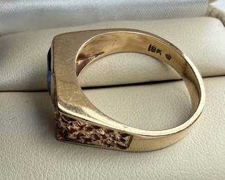 This lot features a mid-century men’s 10k gold ring with blue spinel in a size 11 with a total approx. weight of 6.59 grams.

