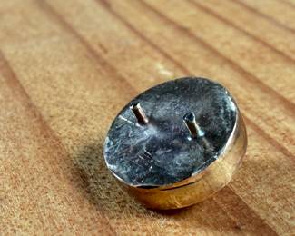 This lot features a carved "moon" moonstone set in 14k gold with a total approx. weight of 1.19 grams.

