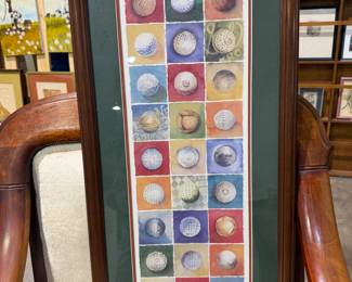 Framed artist signed print of evolution of golf ball art