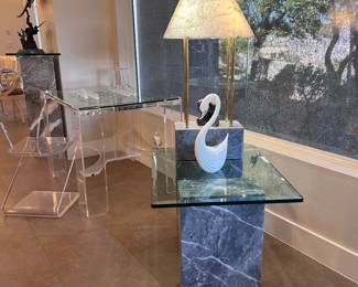 Beveled glass top side table with grey marble bases.