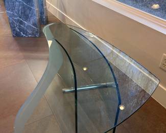 Modern Glass Bean coffee table with metal accents. 