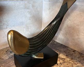 Dolbi Cashier Metal Fish Sculpture on black wood base. 