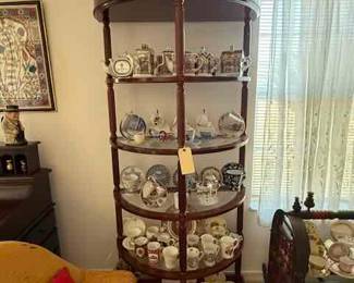 Pair of Demilune Etageres, collection of British Royal pates and mugs and cups and saucers, English teapot collection, cup and saucer collection