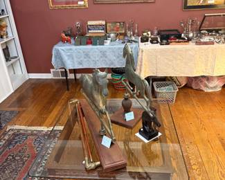Living Room 
Horse weather vanes, canes, & bust