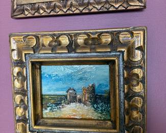Living Room 
Ornate frame with tower painting 