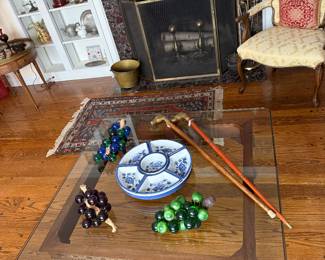 Living Room
Glass top coffee table 
Brass horse head canes