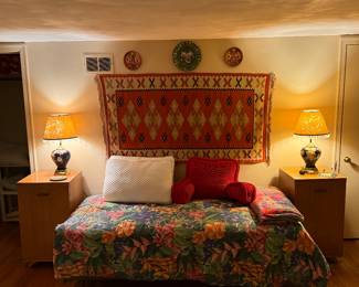 Upstairs Bedroom 
Twin bed
Woven rug/wall hanging 