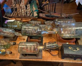 Large selection of ships in bottles