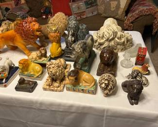 Collection of lions- figurines, bookends, etc.