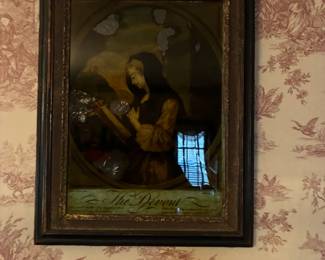 Antique framed artwork is found throughout the house
