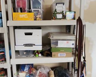 Assorted Collectibles and Household Items on Shelving Unit