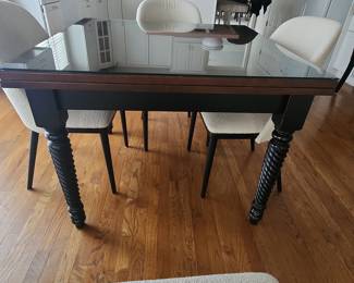Arhaus Dining Table with Glass Top and Turned Legs