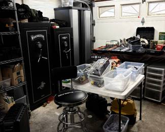 Gun safes  cabinet full of gun cleaning supplies 