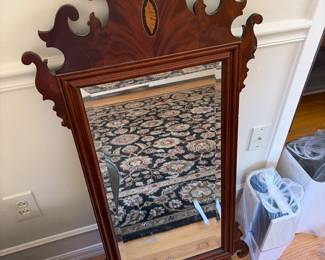 Traditional carved wood wall mirror with a federal/ Hepplewhite style crest on top