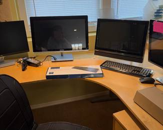 Desk with monitors and lap tops 