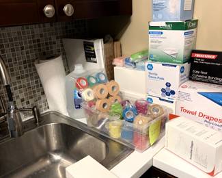 A great assortment of medical items, including surgical orthopedic emergency, sterile gloves, most brand, new emergency kit