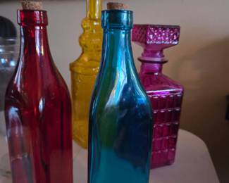 Set of Four Colored Glass Bottles with Cork Stoppers