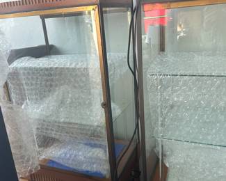 Set of two Art Deco Maple & Brass Showcases. 67” tall, 26” wide, 18” deep.
The actual interior case height is 36” tall.