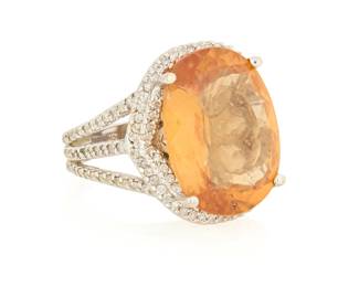 1082
A 14K White Gold, Garnet and Diamond Ring
Centering an oval grossularite garnet measuring approximately 20.00 x 15.15 x 7.47 mm, accented by round diamonds weighing approximately 1.28 carats

Size: 7 1/4
13.7 grams gross
Estimate: $1,000 - $1,500