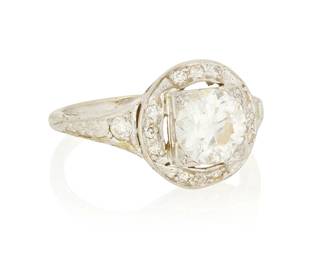 1019
An 18K White Gold and Diamond Ring
Centering an old European-cut diamond weighing approximately 1.00 carat, accented by single-cut diamonds

Size: 6 1/2
3.4 grams gross
Estimate: $600 - $800