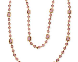 1156
CHANEL: A Gold Tone and Purple Glass 'Chicklet' Necklace, 1981
Designed as a long chain featuring round and rectangular amethyst colored glass links, signed on charm: Chanel, double C, 1981

Length: 57 in.
167 grams gross
Estimate: $1,000 - $1,500