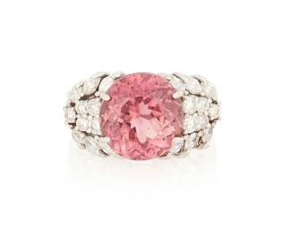 1023
A 14K White Gold, Pink Tourmaline and Diamond Ring
Centering a round mixed-cut pink tourmaline weighing approximately 6.56 carats, accented by round and marquise-shaped diamonds

Size: 7 3/4
8.1 grams gross
Estimate: $2,500 - $3,500