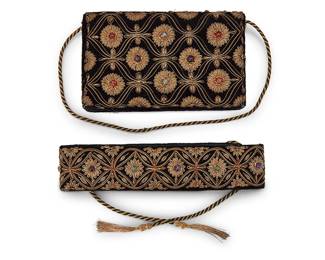 1166
A Set of Vintage Embroidered Velvet Evening Accessories
Comprising a black velvet Byzantine-style evening bag and matching tie belt, each with elaborate metal thread bullion embroidery with floral and medallion motifs featuring set hardstone beads including amethyst and moonstone, and with back and gold cording straps and tasseled ties, likely French
2 pieces

Bag: 5 in. x 8 in. x 1 in., strap drop: 21 in.; Belt: 27 3/4 in. x 2 1/8 in., including ties: 64 in.
Estimate: $200 - $300