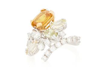 1016
An 18K Bi-Color Gold, Diamond and Gem-Set Ring
Centering a yellowish orange synthetic stone, accented by three marquise-shaped light yellowish green stones, finished with round diamonds weighing approximately 0.75 carat

Size: 7
7.1 grams gross
Estimate: $800 - $1,200