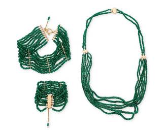 1046
A Gold and Emerald Beaded Group
Including a necklace, collar and bracelet featuring multiple strands of faceted rough emerald beads finished with 14k gold clasps
3 pieces

Necklace: 26 in., Collar: 13 1/2 in., Bracelet: 6 1/2 in.
205.2 grams gross
Estimate: $1,000 - $2,000