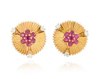 1004
Tiffany & Co.: A Pair of 14K Gold, Ruby and Diamond Earclips
Of a spray design centering round rubies and finished with six round diamonds, Tiffany & Co.
2 pieces

Measures: 5/8 in.
7.7 grams gross
Estimate: $400 - $600