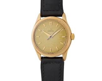 1152
Omega: A 14K Gold Watch
Dial: 30.00 mm, round with baton hour markers
Case: 36.00 mm
Closure: black leather strap with gold plated buckle clasp
Signed: dial and clasp

Inner circumference: 7 - 8 1/2 in.
40.2 grams gross
Estimate: $600 - $800