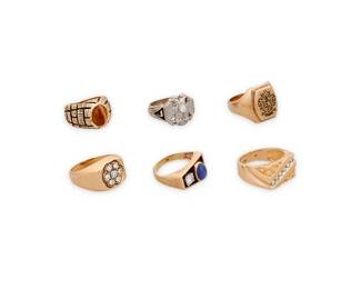 1099
A Group of Gold Rings
Including five 14k gold rings accented by diamonds and synthetic tigers-eye and star sapphire, and one 10k gold crest ring
6 pieces

Sizes: 5 1/2-10
62.1 grams gross
Estimate: $2,500 - $3,500