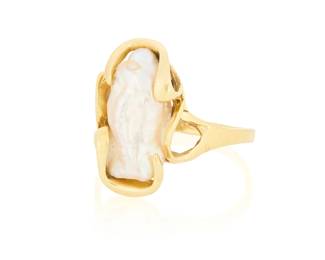 1061
A 14K Gold and Baroque Pearl Ring
Featuring a single baroque pearl set in an organic gold design

Size: 8 1/4
4.3 grams gross
Estimate: $200 - $300