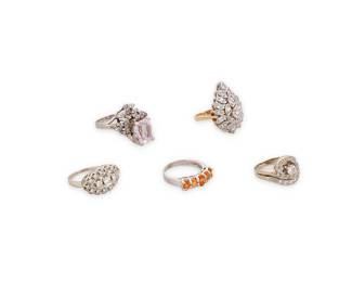 1027
A Group of 14K White Gold and Gem-Set Rings
Including five rings set with diamonds, topaz and kunzite
5 pieces

Size: 4 1/2 - 6
27.4 grams
Estimate: $800 - $1,200