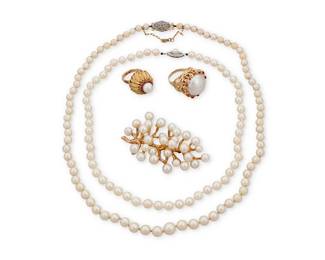 1094
A Group of Gold and Cultured Pearl Jewelry
Including two single strands of cultured pearl beads, finished with 14k gold and 18k white gold clasp, together with two 14k gold and cultured pearl rings, and a foliate design 14k gold and cultured pearl brooch
5 pieces

Necklaces: 18 in. and 23 in., Rings: 6 1/2 and 6 1/4, Brooch: 3 x 1 1/2 in.
116.0 grams
Estimate: $600 - $800