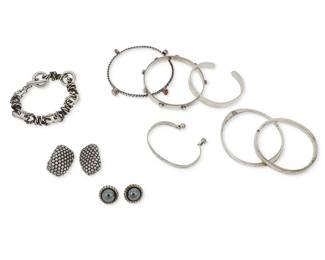 1170
A Group of Sterling Silver Jewelry
Comprising six silver bracelets including a Leonore Doskow sterling silver cuff with dangles, a hammered silver bangle marked JL, and two set stone bangles, one with pearls and one with gemstones, a chunky sterling silver chain link bracelet, and a mixed metal cuff engraved: "Obama," as well as a pair of chunky Simon Sebbag sterling silver earrings and a pair of small sterling silver domed earrings, most marked for sterling and three marked for maker
11 pieces

Bracelets: 8 1/4 in. to 6 1/4 in. inner C; Earrings: 1 1/4 in. H and 3/4 in. Dia.
195.9 grams gross
Estimate: $600 - $800