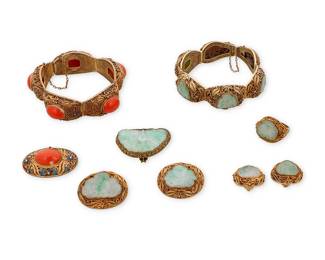 1041
A Group of Silver Gilt, Coral and Jade Jewelry
Including two bracelets, four brooches, one ring and a pair of earrings featuring oval coral cabochons and carved jade
9 pieces

Bracelets: 6 3/4 and 7 1/4 in., Brooches: 1 1/4 - 1 1/2 in., Ring: 7 3/4, Earrings: 7/8 in.
146.4 grams gross
Estimate: $400 - $600