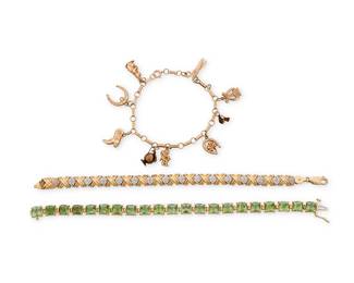 1104
A Group of Gold Bracelets
Including two 14k gold bracelets accented by peridot and round diamonds, together with a 10k gold charm bracelet featuring nine charms
3 pieces

Measures: 7 1/2 - 8 1/4 in.
50.1 grams
Estimate: $600 - $800