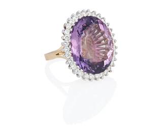 1083
A 14K Bi-Color Gold, Amethyst and Diamond Ring
Centering an oval amethyst weighing approximately 53.40 carats, encircled by round diamonds weighing approximately 2.25 carats

Size: 7 1/2
25.0 grams gross
Estimate: $2,000 - $3,000