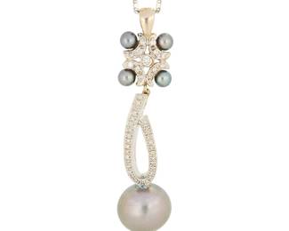 1024
A 14K White Gold, Cultured Pearl and Diamond Pendant Necklace
Centering a long drop style pendant featuring a round grey pearl measuring approximately 13.93 mm, accented by smaller round black cultured pearls and round diamonds weighing approximately 0.50 carat, all suspended from a long fancy link chain

Chain: 22 in., Pendant: 2 1/4 x 1/2 in.
14.5 grams gross
Estimate: $1,000 - $2,000