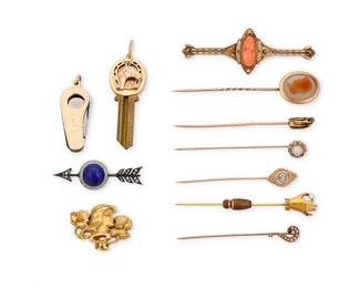 1100
A Group of Gold and Gem-Set Jewelry
Including four 10k gold pins, three 14k gold pins, a 14k gold key top, a 14k gold cigar-cutter, a silver topped-gold brooch and a 20k floral brooch, all accented by lapis lazuli, agate, coral, seed pearls and rose-cut diamonds
11 pieces

48.6 grams gross
Estimate: $800 - $1,200