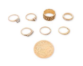 1058
Group of Gold Jewelry
Including six rings and one 14k gold brooch together with one 18k gold ring, featuring round diamond accents

Rings: 5 - 8 1/2, Brooch: 1 1/4 in.
26.7 grams gross
Estimate: $150 - $200