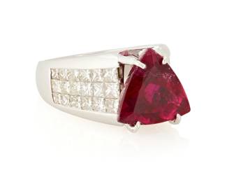 1018
A 18K White Gold, Rubellite Tourmaline and Diamond Ring
Centering a triangular-cut rubellite tourmaline weighing approximately 8.84 carats, flanked by three rows of princess-cut diamonds weighing approximately: 2.64 carats

Size: 5 1/2 with sizing beads
18.4 grams gross
Estimate: $3,000 - $5,000
