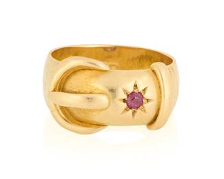 1141
A 18K Gold and Ruby Ring
Of a buckle design featuring a star motif accented by a singular round ruby, with English hallmarks

4.4 grams gross
Size: 6
Estimate: $500 - $700