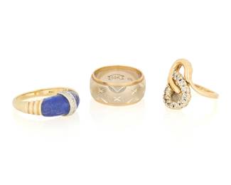 1110
Three 14K Gold and Gem-Set Rings
One including carved lapis lazuli accented by round diamonds, a bi-color gold band etched with six-pointed stars and one of a looped design set with round diamonds
3 pieces

Size: 3 - 6 1/2
14.3 grams gross
Estimate: $700 - $900