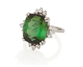 1077
A White Gold, Green Tourmaline and Diamond Ring
Centering a modified cushion-cut green tourmaline weighing approximately 12.53 carats, accented by round diamonds weighing approximately 0.24 carat

Size: 6
7.3 grams gross
Estimate: $1,200 - $1,800